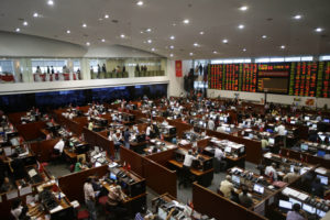 In this May 17, 2013 photo, trading continues at the Philippine Stock Exchange at the financial district of Makati city, east of Manila, Philippines. As the Philippine economy skyrocketed 7.8 percent in the first quarter, outpacing China, the middle class in the Southeast Asian nation that has been held back by widespread poverty, political strife and corruption is for the first time in decades reaping the profits of an economic boom. (AP Photo/Bullit Marquez)