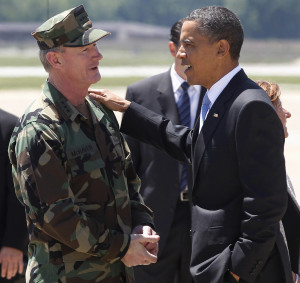 In this May 6, 2011, file photo President Barack Obama talks with U.S. Navy Vice Admiral William H. McRaven, commander of Joint Special Operations Command (JSOC), at Campbell Army Airfield in Fort Campbell, Ky., just days after McRaven led operational control of Navy SEAL Team Six's successful mission to get Osama bin Laden. McRaven ordered military files about the raid on bin Laden's hideout to be purged from Defense Department computers and sent to the CIA, where they could be more easily shielded from ever being made public. (AP Photo/Charles Dharapak, File)