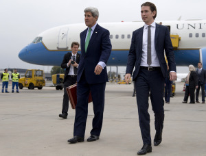U.S. Secretary of State John Kerry walks to his car with Austria's Foreign Minister Sebastian Kurz, right, as he arrives at Vienna International Airport, in Vienna, Austria, Wednesday, Oct. 15, 2014. Kerry meets Wednesday in Vienna with Iranian Foreign Minister Mohammad Javad Zarif to try and advance nuclear talks and meet the target date of Nov. 24. (AP Photo/Carolyn Kaster, Pool)