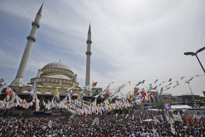 Supporters of Selahattin Demirtas, co-chair of the the pro-Kurdish People's Democratic Party (HDP) wait for him to arrive to deliver a speech during a rally in Istanbul, Turkey, Sunday, May 24, 2015. Turkey will hold general election on June 7, 2015. Although it is a relatively small party, all eyes will be on HDP. If it reaches the minimum 10 percent threshold required for entering parliament as a party, it could effectively thwart Turkey's President Recep Tayyip Erdogans ambition to lead a presidential system following a constitutional change. (AP Photo/Emrah Gurel)